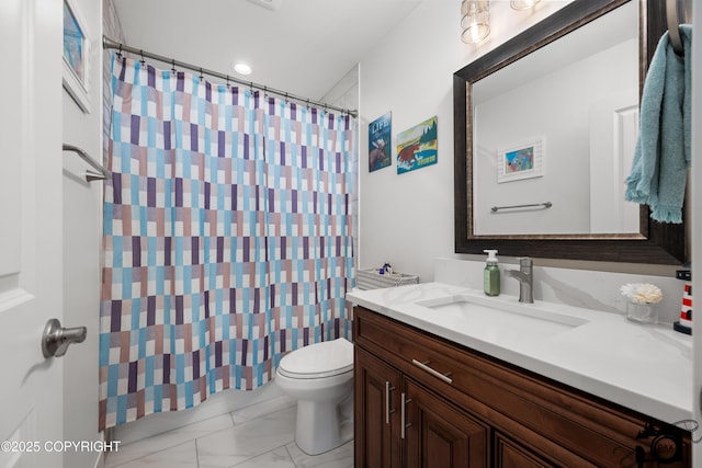 bathroom with vanity, toilet, and walk in shower