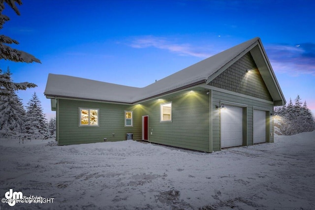 view of front of property with a garage