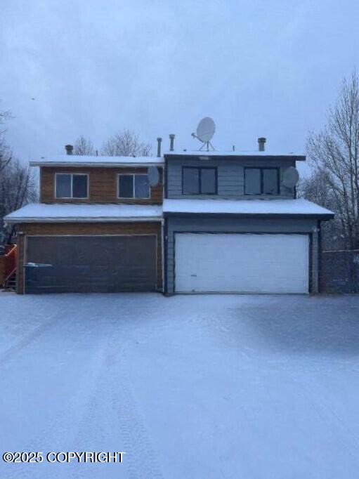 front of property featuring a garage