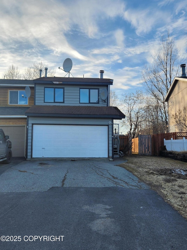 view of front of property featuring fence