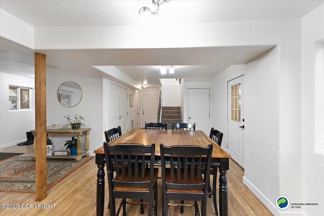 dining space with light wood-type flooring