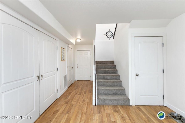 stairway featuring hardwood / wood-style flooring