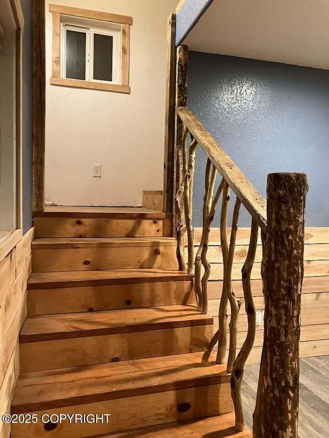 stairs with hardwood / wood-style floors