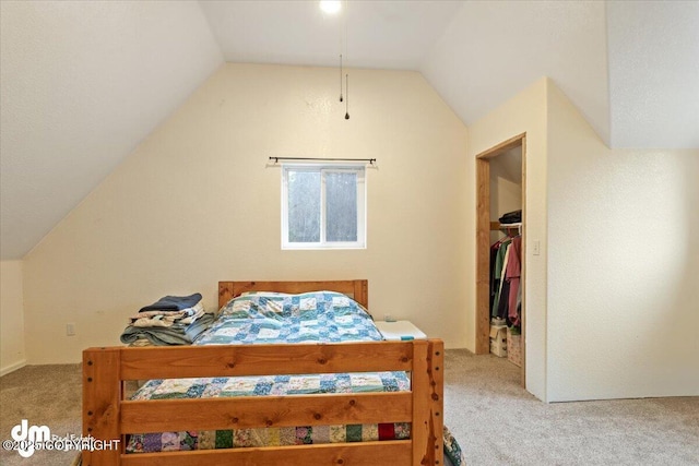 carpeted bedroom featuring lofted ceiling