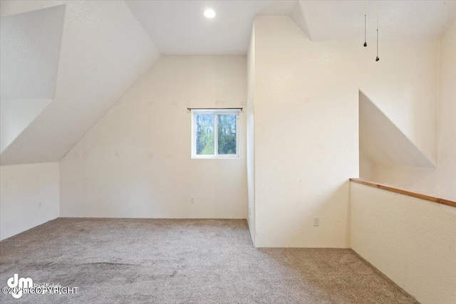 bonus room featuring carpet and lofted ceiling