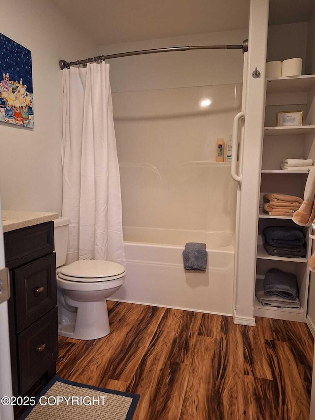 full bathroom featuring vanity, toilet, shower / bath combo, and wood-type flooring