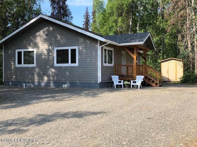 exterior space with a shed