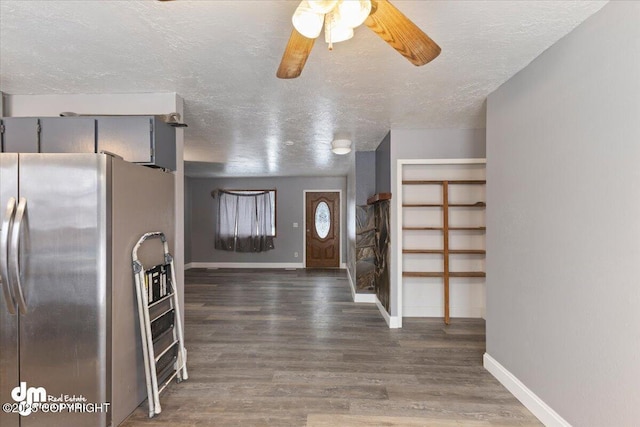 kitchen with dark hardwood / wood-style flooring, ceiling fan, a textured ceiling, and stainless steel refrigerator with ice dispenser