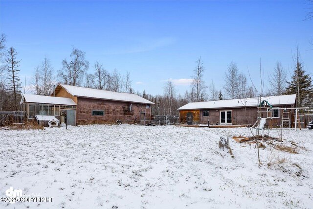 view of snow covered house