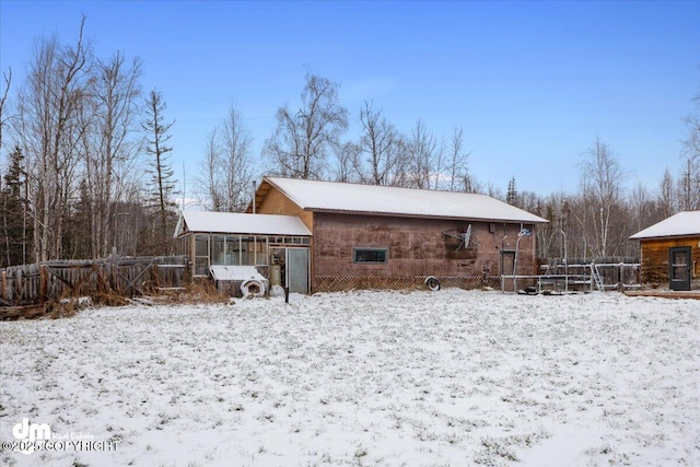 view of snow covered house