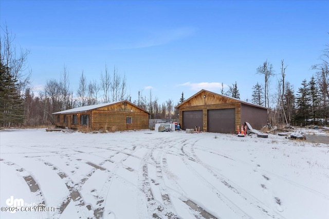 exterior space with an outbuilding and a garage