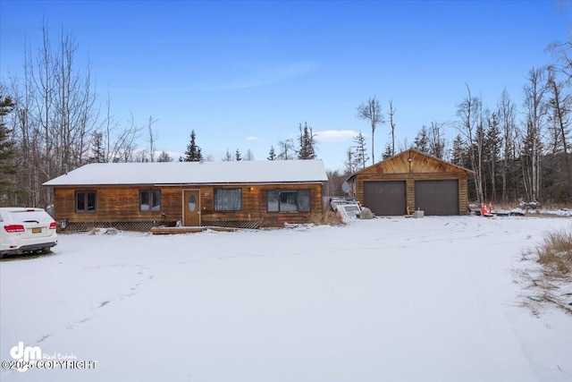 single story home with an outbuilding and a garage