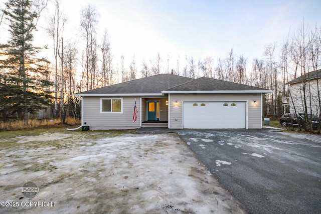 ranch-style house featuring a garage