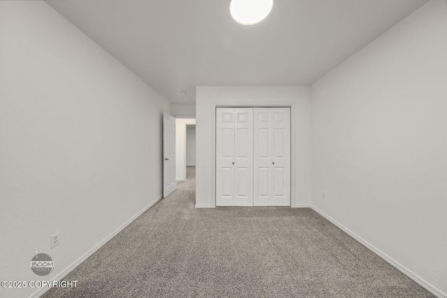 unfurnished bedroom featuring a closet and carpet