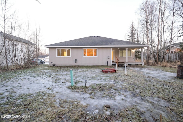 rear view of house featuring a porch