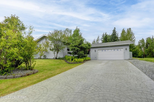 4800 Folker St, Anchorage, AK 99507 - view of front of house featuring decorative driveway, a front yard, and a garage