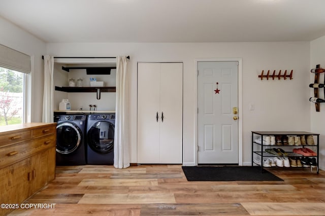 4800 Folker St, Anchorage, AK 99507 - laundry room with separate washer and dryer and light wood-style floors