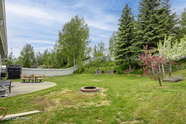 4800 Folker St, Anchorage, AK 99507 - view of yard featuring a patio and an outdoor fire pit