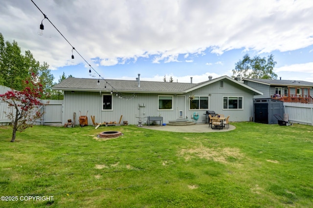 4800 Folker St, Anchorage, AK 99507 - back of house with an outdoor fire pit and a patio area