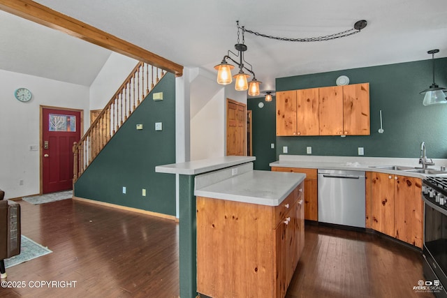 kitchen with dark wood-type flooring, sink, stainless steel dishwasher, a kitchen island, and pendant lighting