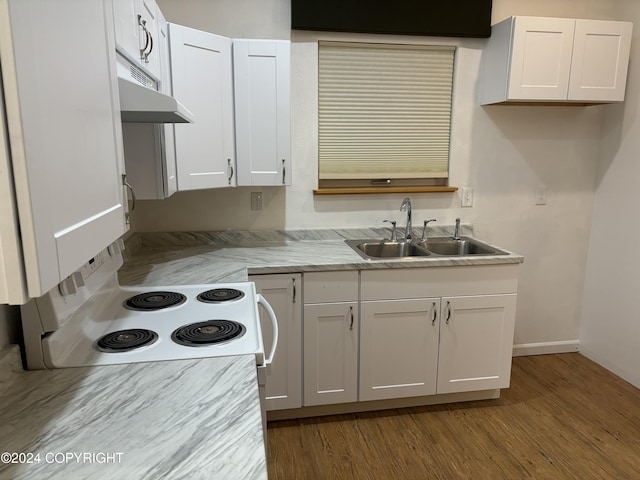 kitchen with sink, white electric stove, hardwood / wood-style flooring, and white cabinetry