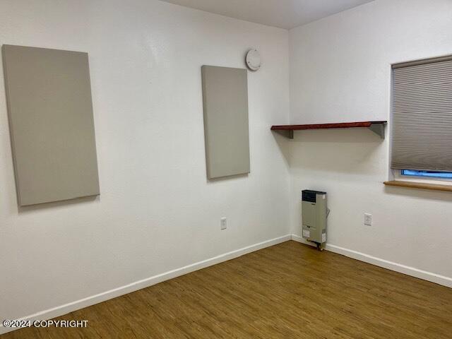 laundry area featuring dark wood-type flooring