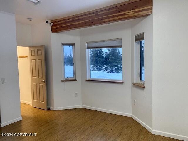 empty room featuring hardwood / wood-style flooring