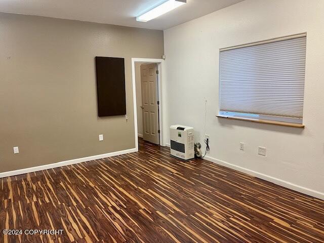 unfurnished room featuring dark hardwood / wood-style floors