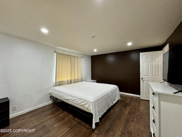 bedroom featuring dark hardwood / wood-style floors