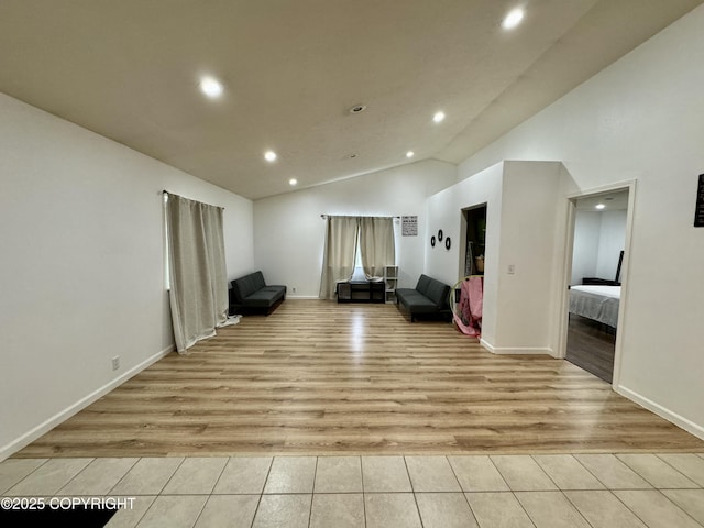 interior space featuring high vaulted ceiling and light wood-type flooring