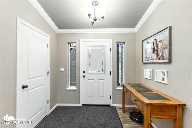 foyer entrance featuring crown molding and hardwood / wood-style flooring