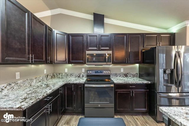 kitchen with lofted ceiling, light stone countertops, stainless steel appliances, and dark brown cabinetry