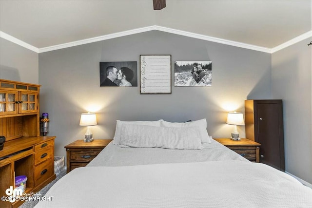 bedroom with crown molding, vaulted ceiling, and ceiling fan