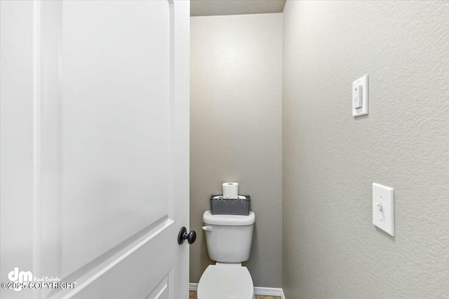 bathroom featuring toilet