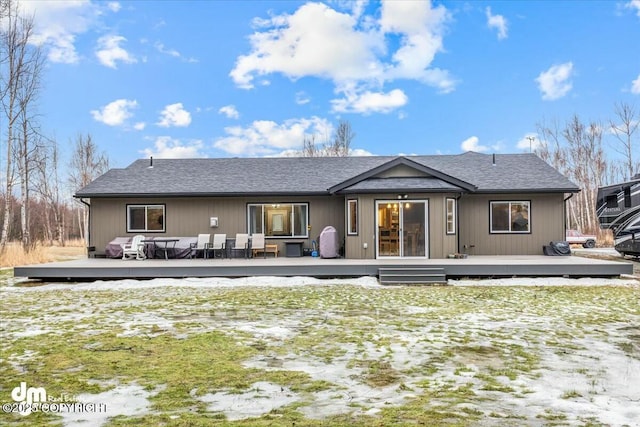 rear view of house with a wooden deck and an outdoor hangout area