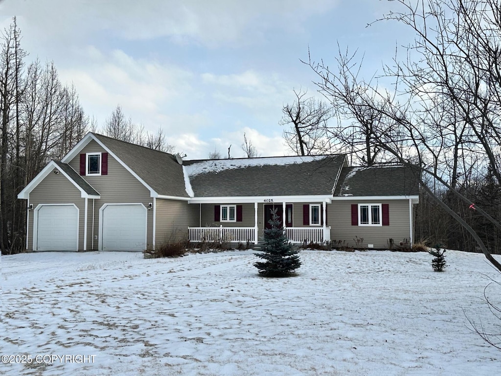 view of front of property featuring a porch and a garage