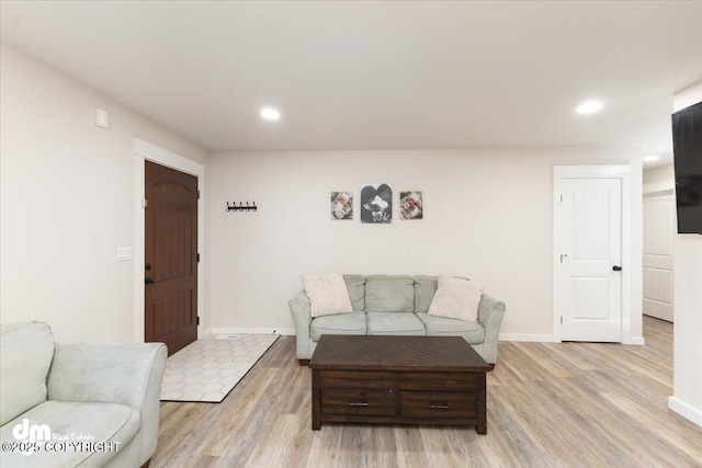 living room with light hardwood / wood-style floors