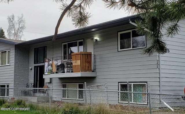 view of home's exterior featuring a balcony