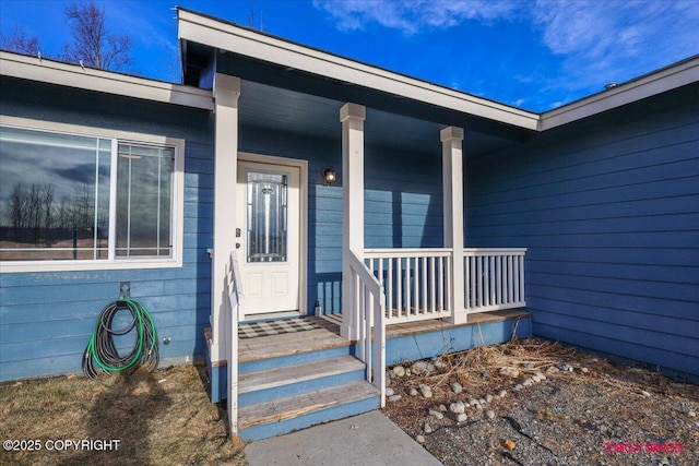 entrance to property featuring covered porch