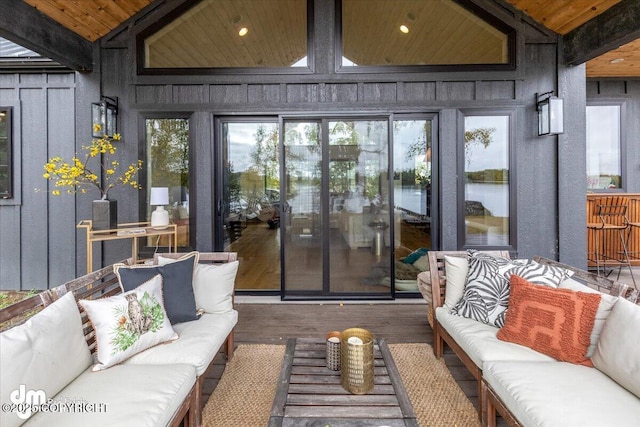 sunroom with lofted ceiling with beams and wood ceiling