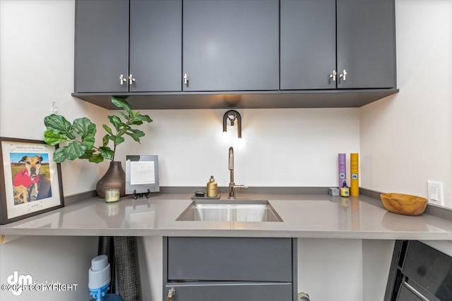 kitchen featuring sink and gray cabinetry