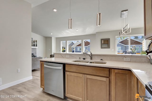 kitchen featuring sink, dishwasher, hanging light fixtures, light stone countertops, and light wood-type flooring