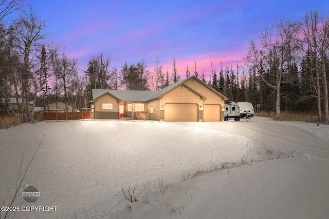 view of front of property featuring a garage