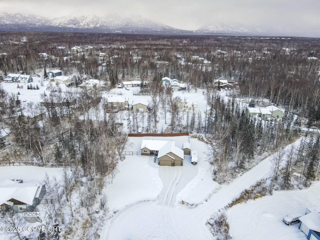 snowy aerial view with a mountain view