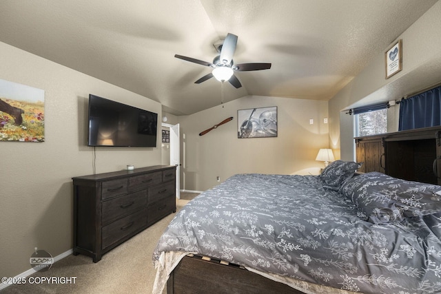 carpeted bedroom with ceiling fan, lofted ceiling, and a textured ceiling