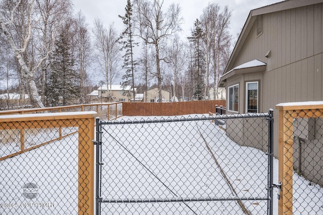 view of snow covered gate