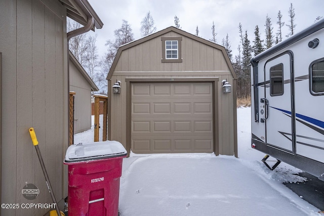 view of snow covered garage