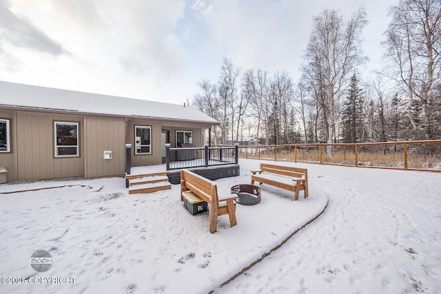 yard covered in snow featuring a wooden deck