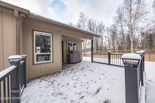 exterior space featuring a wooden deck and grilling area