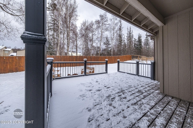 view of snow covered deck